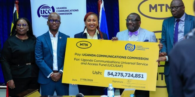Part of MTN's leadership team poses for a photo with UCC's Leaders shortly after the cheque handover