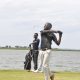 Godfrey Nsubuga follows the flight of his ball