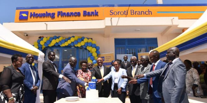 Vice President Jessica Alupo, and Michael Mugabi MD Housing Finance Bank(Center) joins other HFB officials to cut the cake during the opening of Soroti Branch