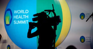 Photographer recording the World Health Summit.