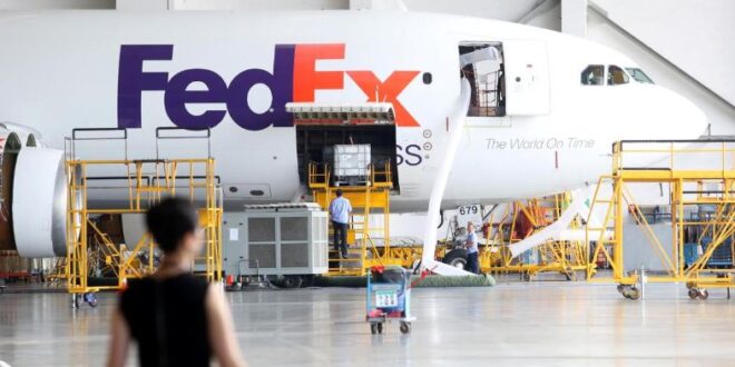 A FedEx Express plane is seen at a maintenance base of Guangzhou Aircraft Maintenance Engineering Company Limited (GAMECO) at the airport in Guangzhou.