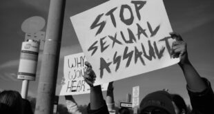 A poster calling for an end to sexual assault during a protest.