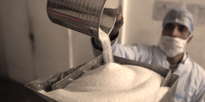 File image: A worker at a sugar factory,