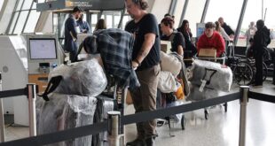 People from the first group of white South Africans granted refugee status for being deemed victims of racial discrimination under United States (US) President Trump's Refugee plan, check in for a connecting flight, at Dulles International Airport, in Dulles, Virginia, US on May 12, 2025.