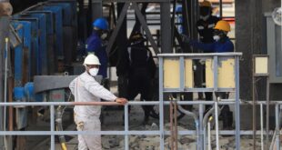 Workers are pictured at the Prospect Lithium Zimbabwe mine in Goromonzi, Zimbabwe on 09 January 2024.