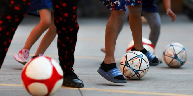 Far from home migrant children kick off own World Cup
