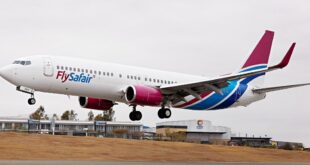 Flysafair plane takes off at an airport.