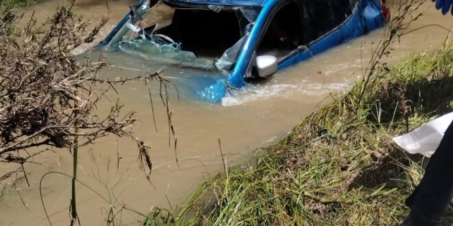 A damaged vehicle is seen after it was swept away by an overflowing stream at Mokotopong outside Polokwane in Limpopo.