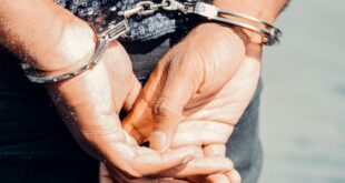 A person in handcuffs following an arrest.