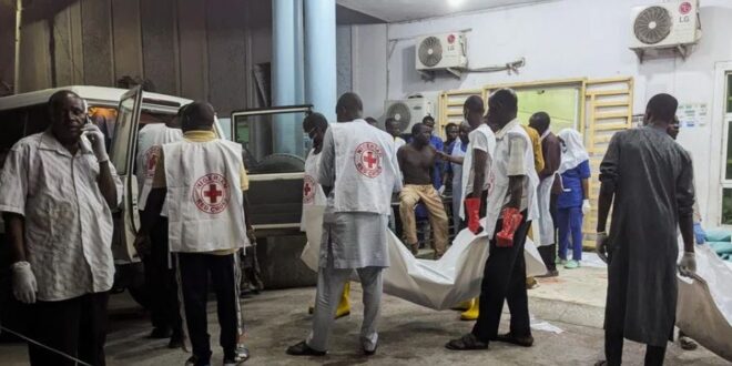 Members of the Nigerian Red Cross carry body bags containing casualties at a Maiduguri hospital following explosions that struck the northeastern city of Maiduguri, Borno State, Nigeria on March 16, 2026.
