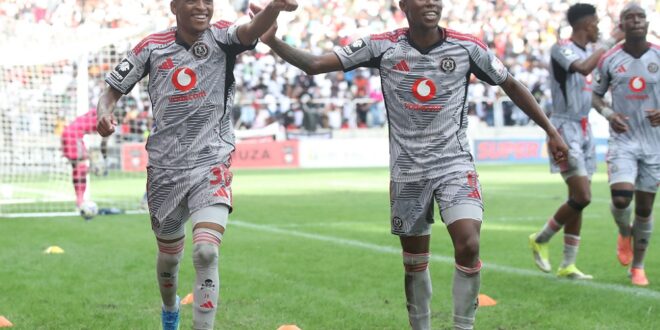 Orlando Pirates players Relebohile Mofokeng and Tshepang Moremi celebrate after winning 6-0 against TS Galaxy.