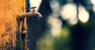 Water leaking from a tap.