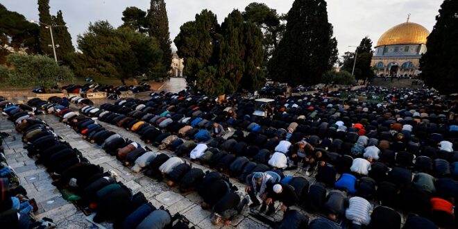 Muslims attend Eid al-Fitr prayers which mark the end of Ramadan, in Al-Aqsa compound, also known to Jews as Temple Mount, amid the ongoing conflict in Gaza between Israel and Palestinian Islamist group Hamas, in Jerusalem's Old City