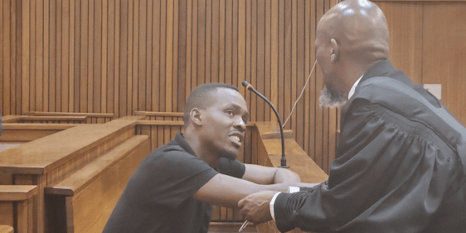 Accused number two in the former Bafana Bafana Captain Senzo Meyiwa murder trial Bongani Ntanzi speaks to his lawyer.