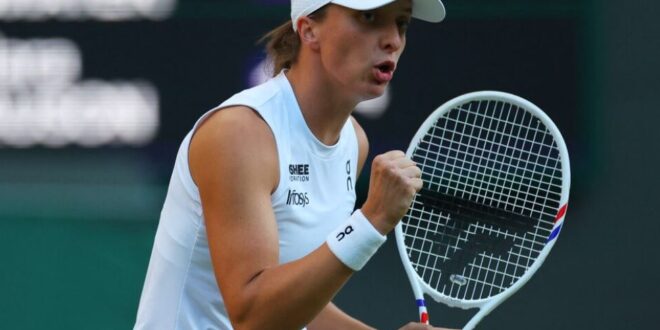 Poland's Iga Swiatek reacts during her round of 16 match against Denmark's Clara Tauson during Wimbledon at All England Lawn Tennis and Croquet Club in London, Britain on July 7, 2025.